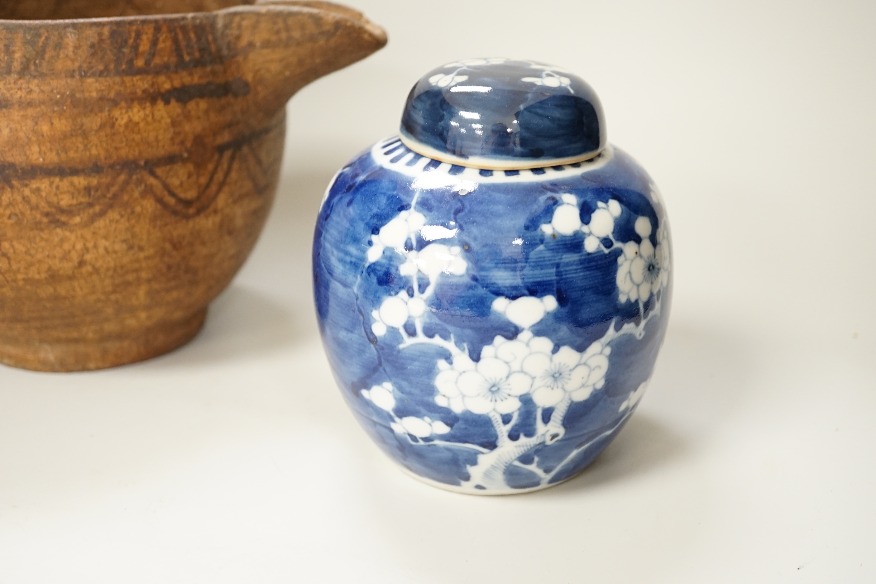 A Chinese blue and white prunus jar and cover, a Japanese Satsuma pottery bowl and a Moroccan terracotta jug, 20cm tall